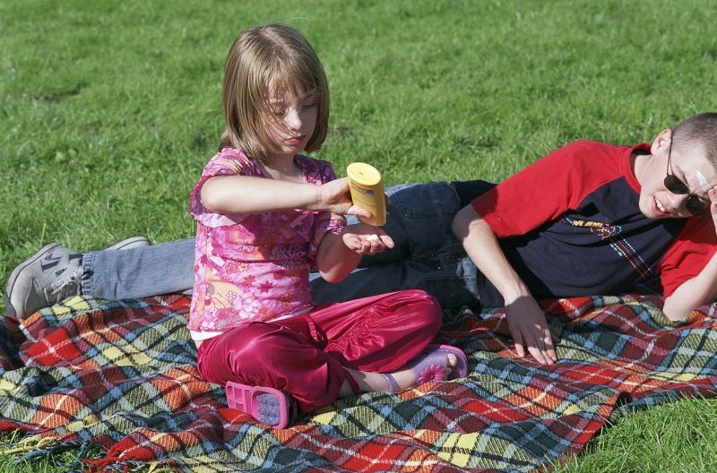 Children applying sunscreen