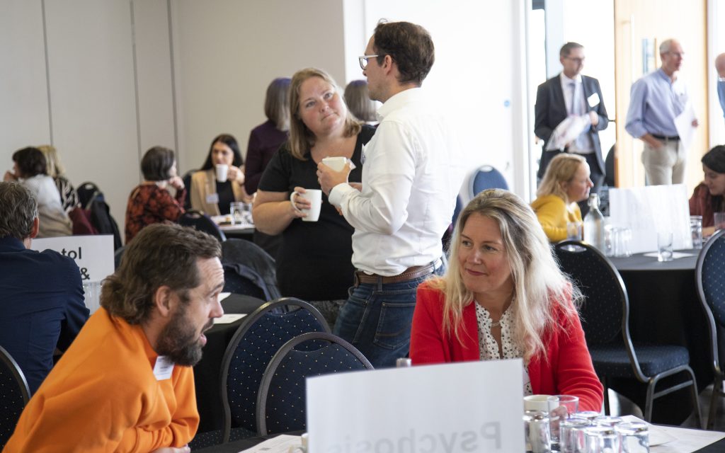 Two people talking at conference